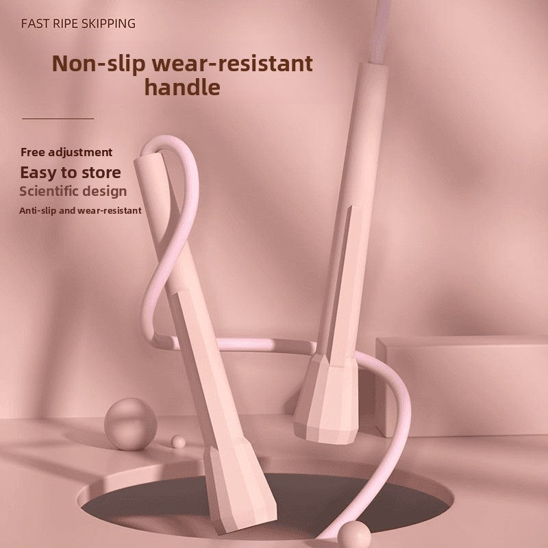 Fitness jump rope for weight loss by FitGearMonarch, featuring non-slip wear-resistant handles in a soft pink hue.