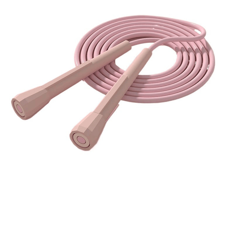Pink jump rope for fitness by FitGearMonarch, with matching handles, coiled on a white background.