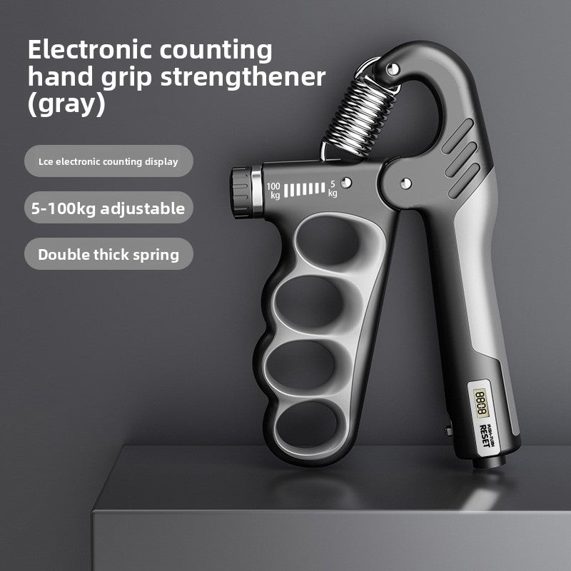 Gray electronic counting hand grip strengthener by FitGearMonarch with adjustable resistance and a small digital display.
