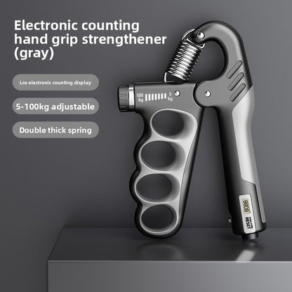 Gray electronic counting hand grip strengthener by FitGearMonarch with adjustable resistance and a small digital display.
